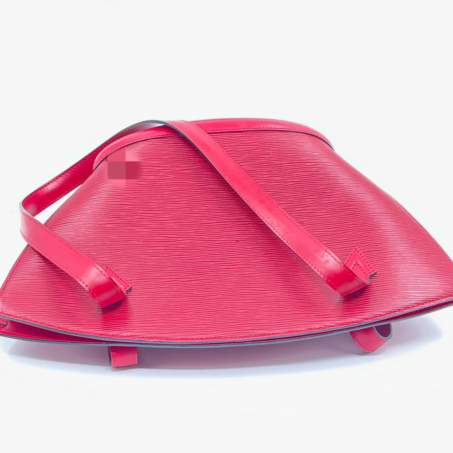 Luxury red genuine leather designer shoulder bag with classic water ripple texture and adjustable shoulder strap.