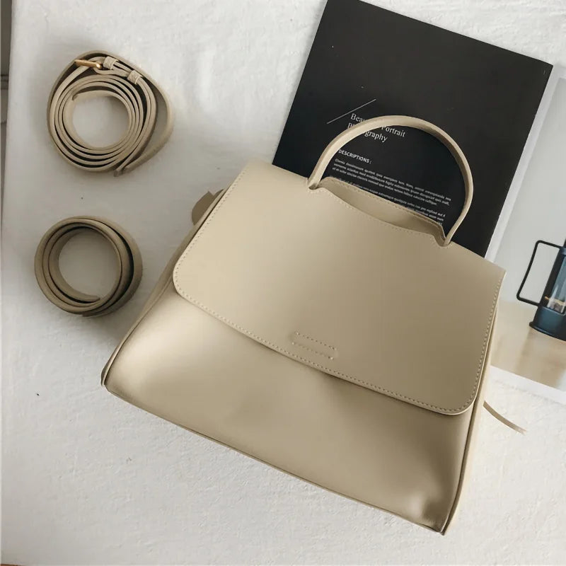 Beige Korean-style designer leather handbag with top handle, flap closure, and detachable crossbody shoulder strap.