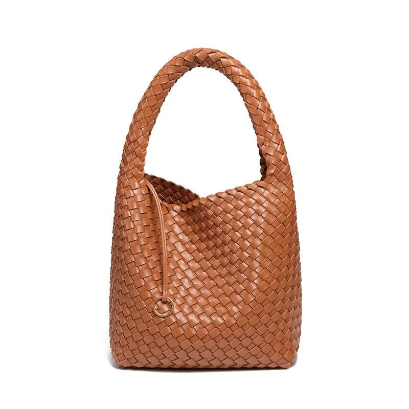Tan woven PU leather bucket bag with a chic top handle and minimalist circular charm for daily commute and shopping.