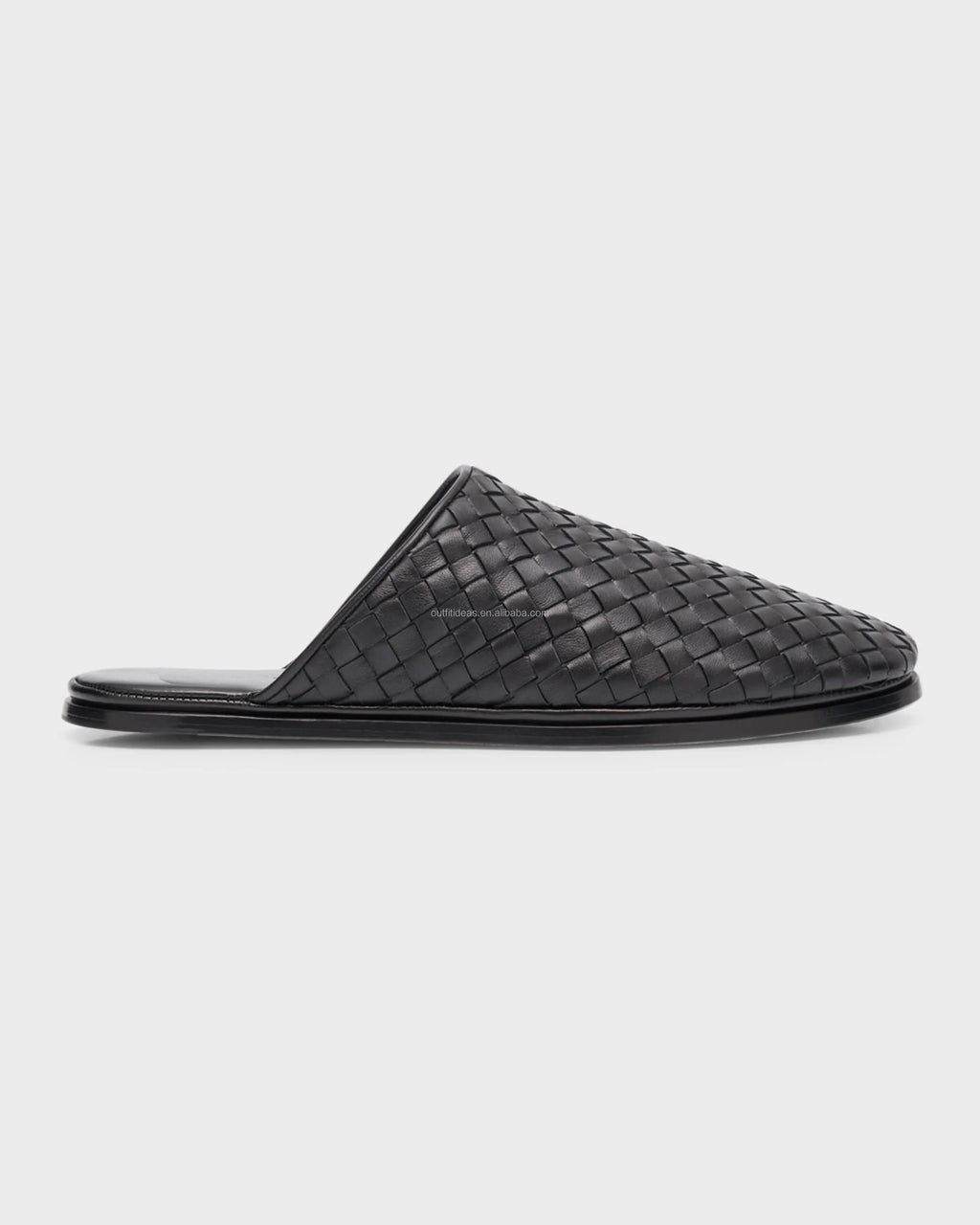 Luxury black woven leather mule loafers with a flat stacked sole, featuring an intricate intrecciato braided design.