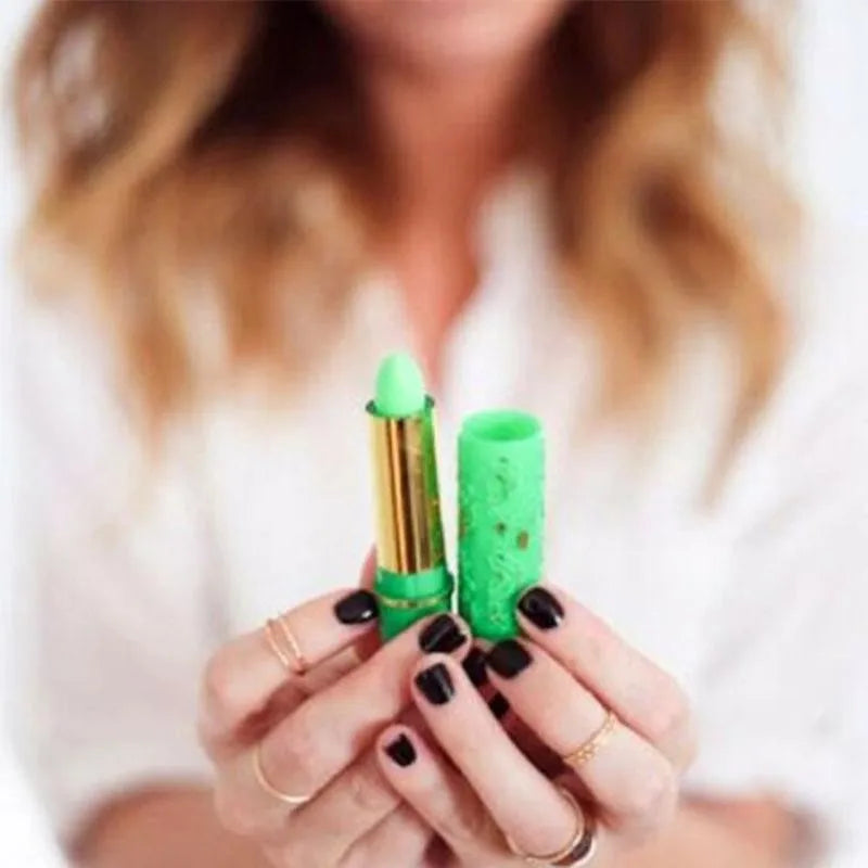 Magic color-changing green lipstick in a gold tube with butterfly embossed cap, long-lasting lip makeup.
