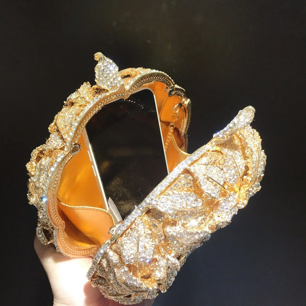 Gold rhinestone flower luxury clutch bag, designer evening purse for wedding parties with crystal leaf embellishments.