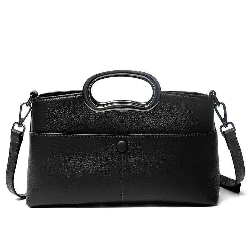 Black pebble PU leather designer handbag with a metallic oval top handle and detachable crossbody shoulder strap.