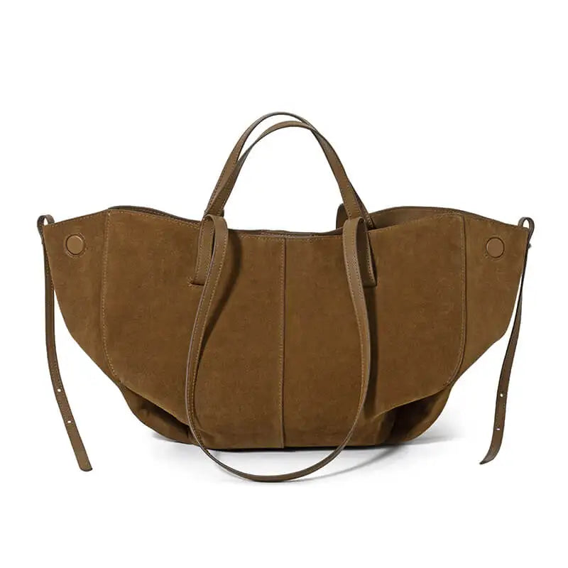 Brown suede designer handbag with soft slouchy silhouette, dual handles, and side strap details for a luxury look.