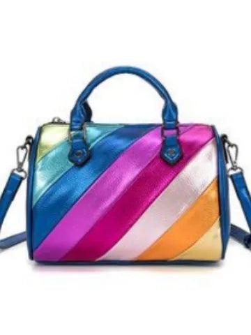 Metallic color-block trunk bag with diagonal rainbow stripes, dual top handles, and a detachable crossbody strap.