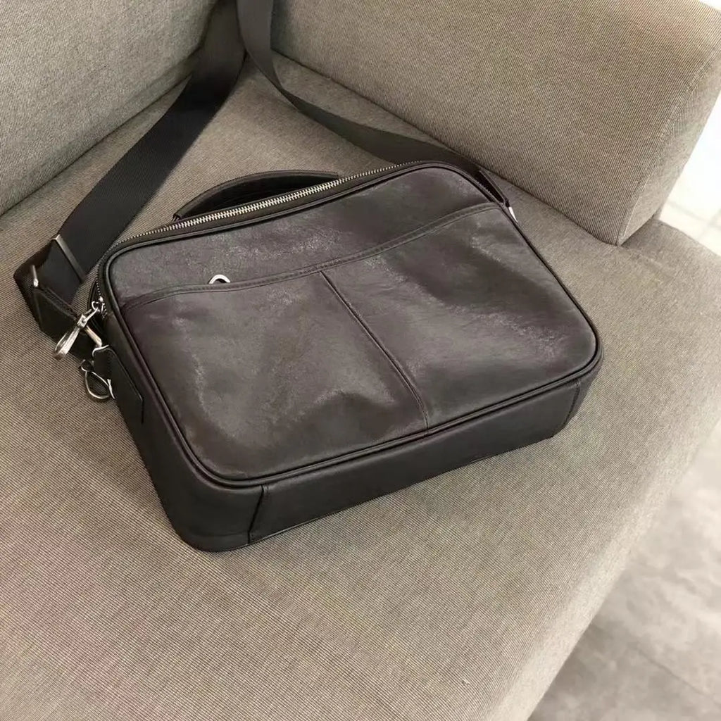 Dark brown top-grain cowhide leather messenger bag, vintage horizontal satchel with adjustable strap for daily business.