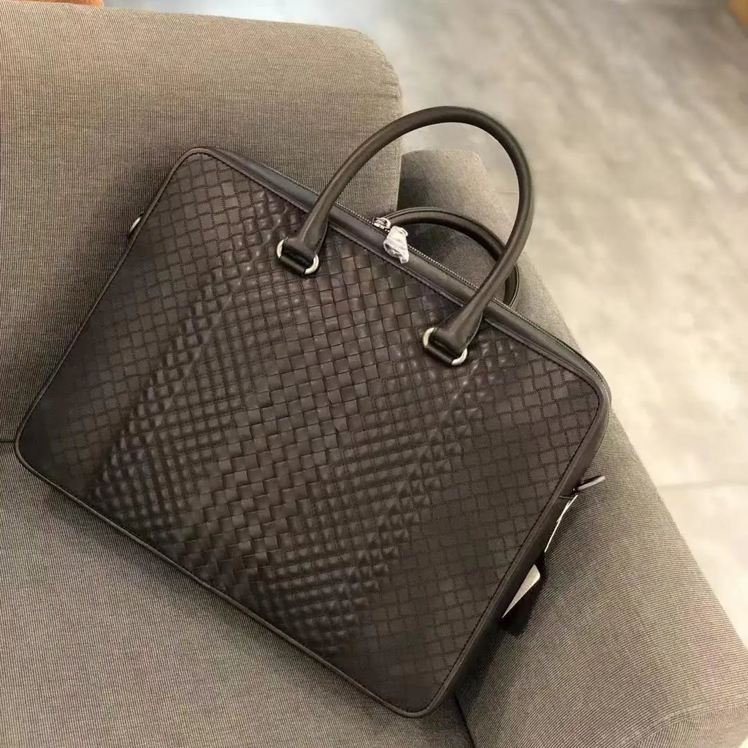 Luxury dark brown woven leather briefcase, slim 13-inch laptop bag in premium waxed calfskin for business.