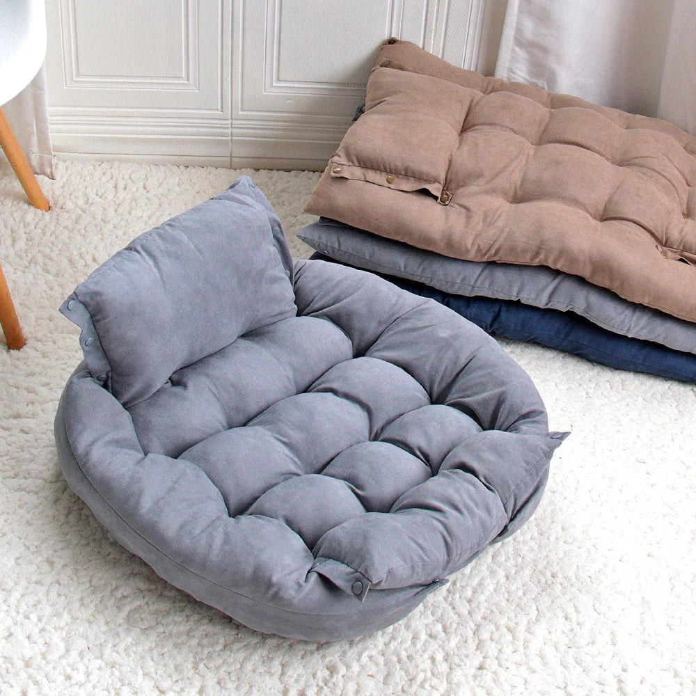 Soft grey plush sofa dog bed for cozy winter comfort, featuring a tufted mattress design for small and large pets.