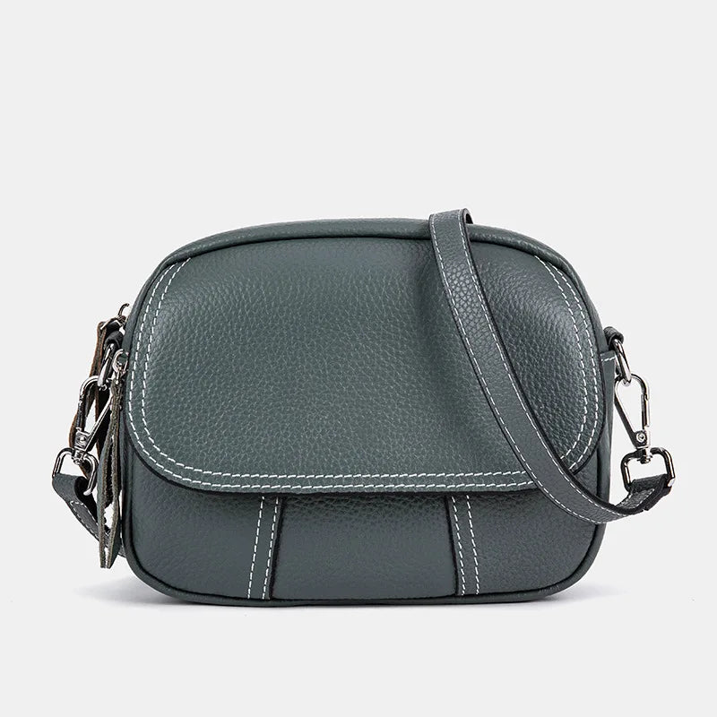Dark gray retro genuine leather crossbody designer handbag with white contrast stitching and adjustable shoulder strap.