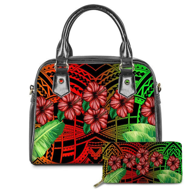 Colorful Polynesian tribal print leather handbag and wallet set with red hibiscus flowers and tropical leaf patterns.
