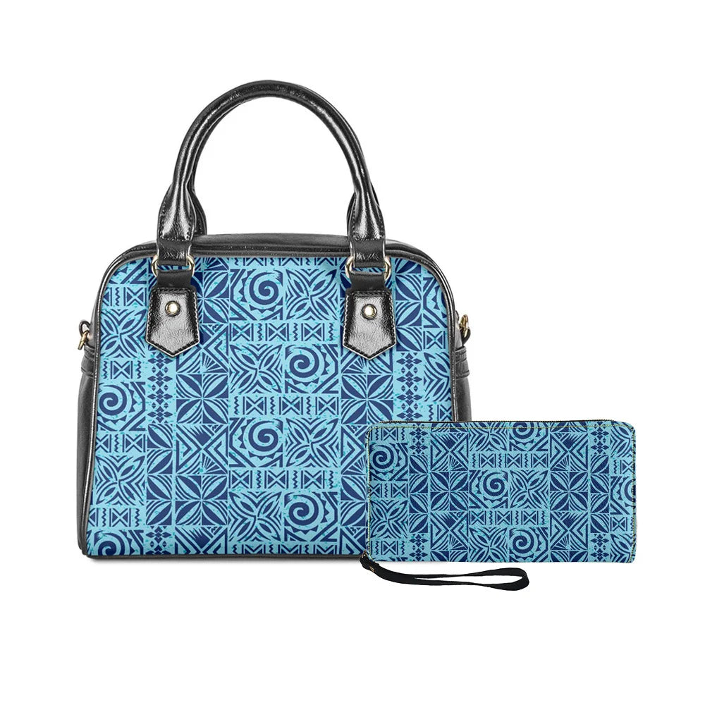 Blue and black Polynesian tribal print handbag and matching clutch set with classic top handle and zip closure.