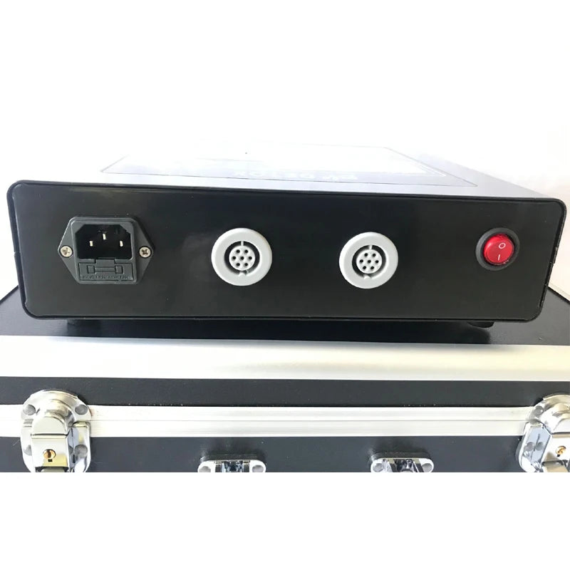 Back panel of dual ionic detox foot spa machine with power input, dual connectors, and red switch on carry case.