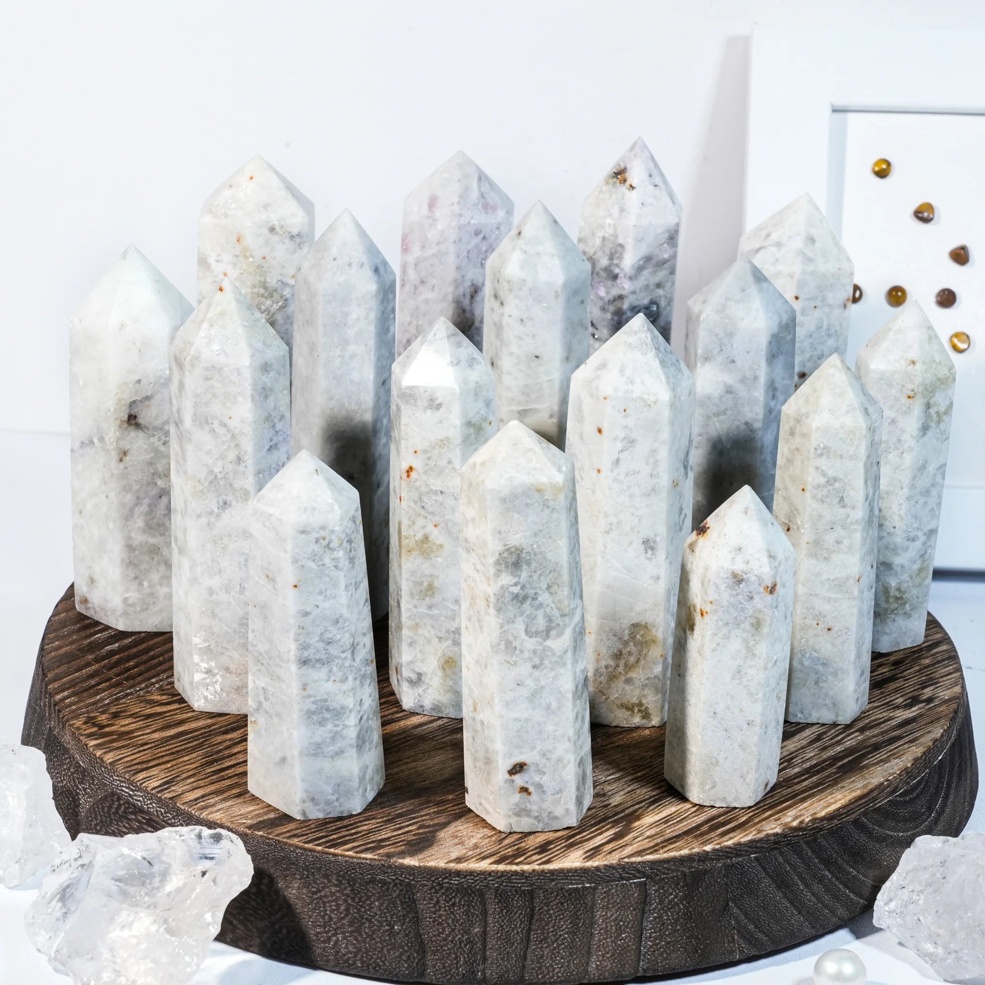 Natural gemstone crystal point tower with multiple tall pointed crystals on a round base.