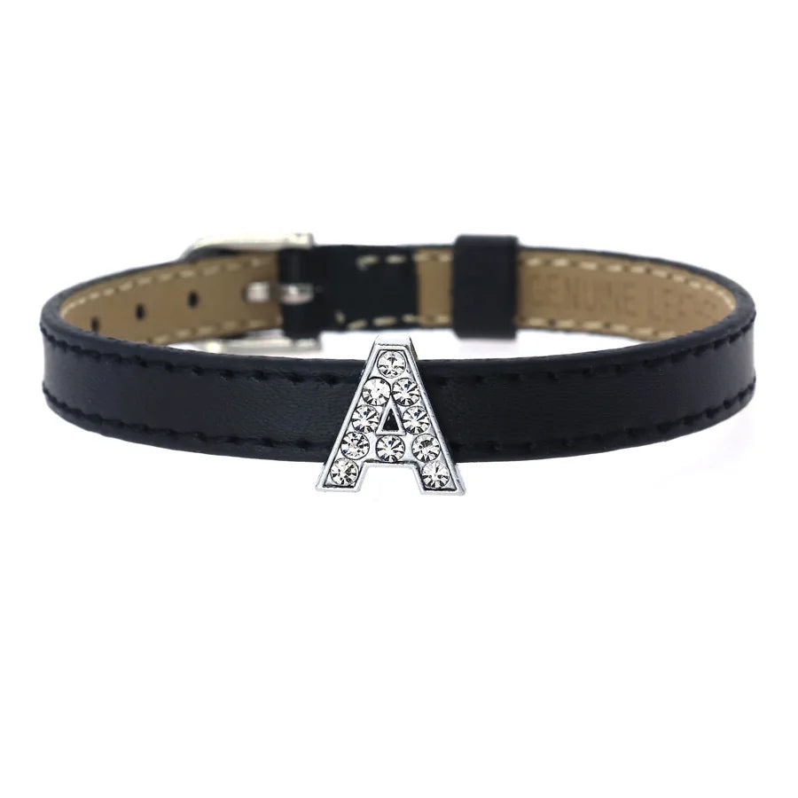 Sparkly rhinestone letter A slide charm on an 8mm black leather pet collar for personalized DIY dog accessories.