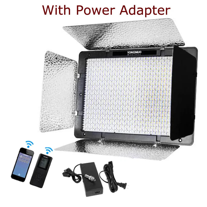 LED video light panel with reflective barn doors, remote control, and power adapter for photography and videography.