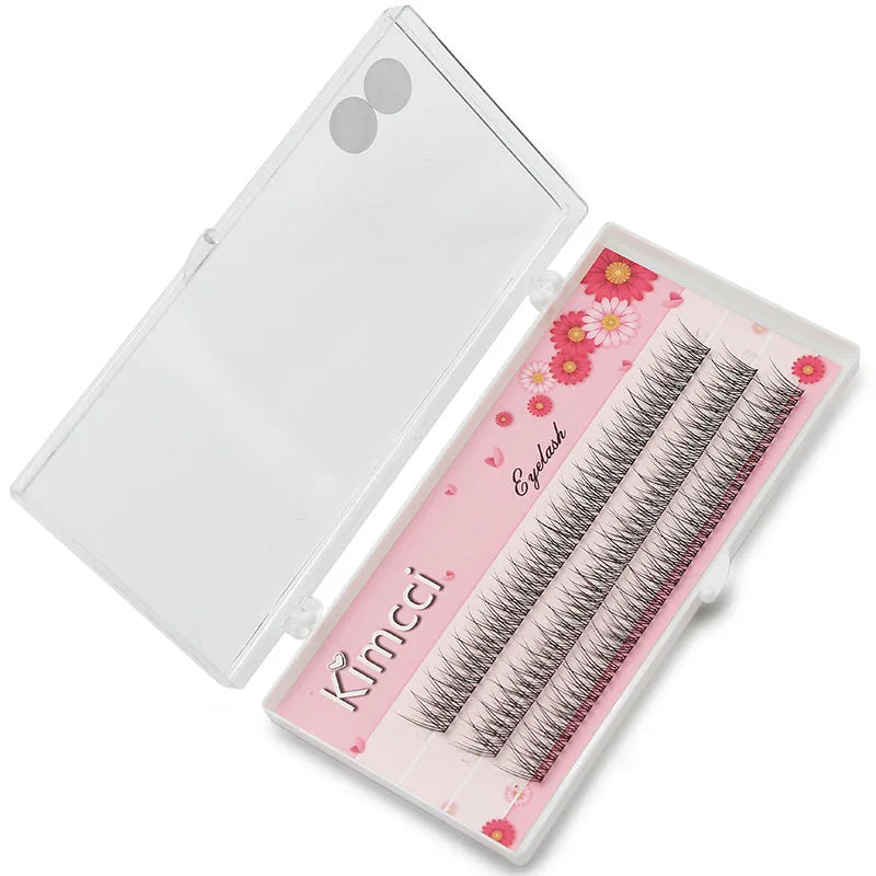 Open plastic case with three rows of black 3D mink individual cluster eyelashes on a floral pink background.