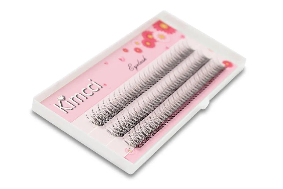 Kimcci mink individual flared cluster lashes in a white tray with pink floral packaging.