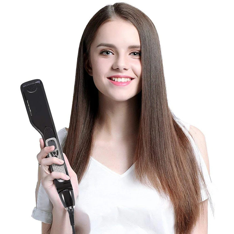 Woman holding a professional black steam hair straightener with digital controls for sleek, salon-quality hair styling.