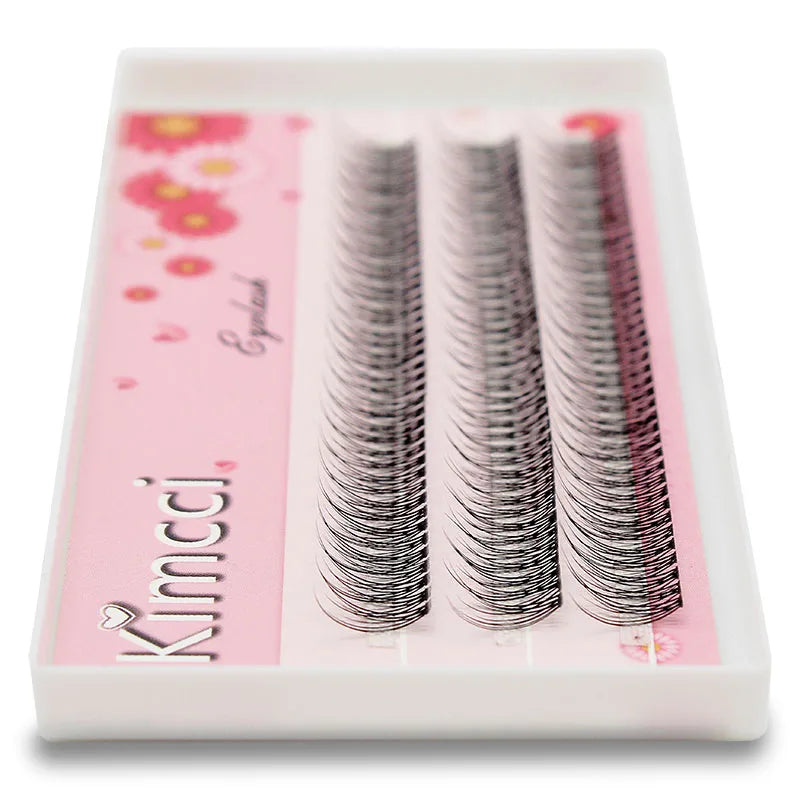 Kimcci black mink individual 3D cluster eyelash extensions arranged in rows on a floral-patterned pink tray.