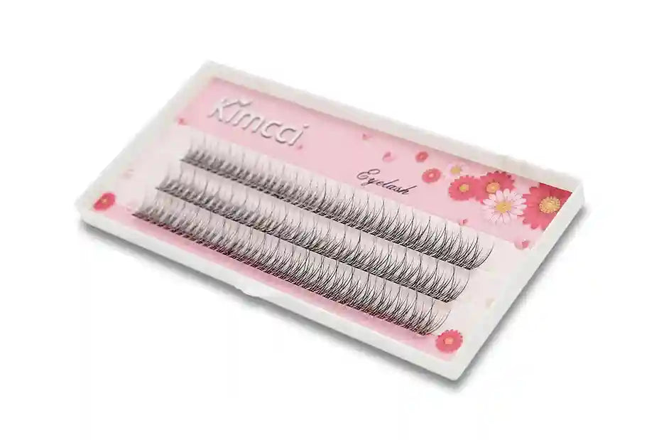 Three rows of black individual mink 3D cluster eyelash extensions in a pink floral tray by Kimcci.