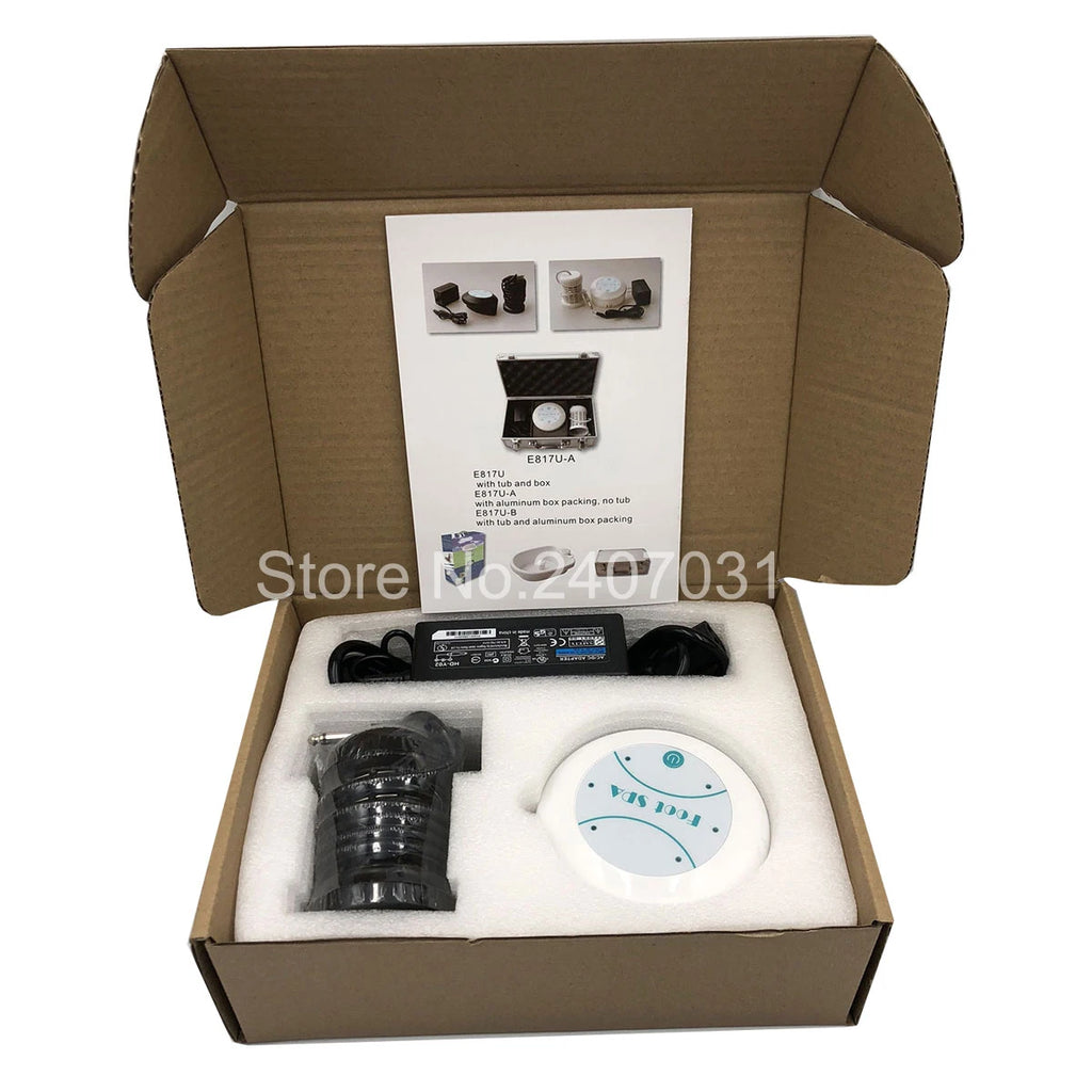 Ionic detox foot spa machine set in cardboard box with white electric array, power adapter, and user manual guide.