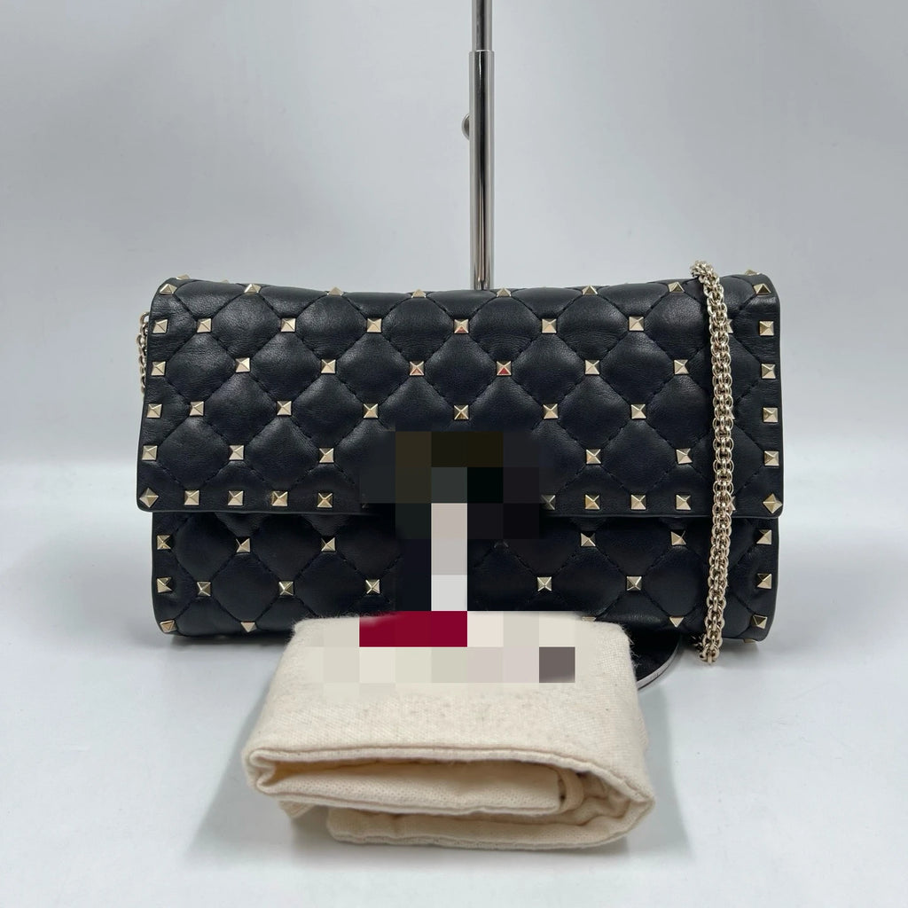 Pre-owned black quilted leather designer shoulder bag with silver rivet studs and a metal chain strap.