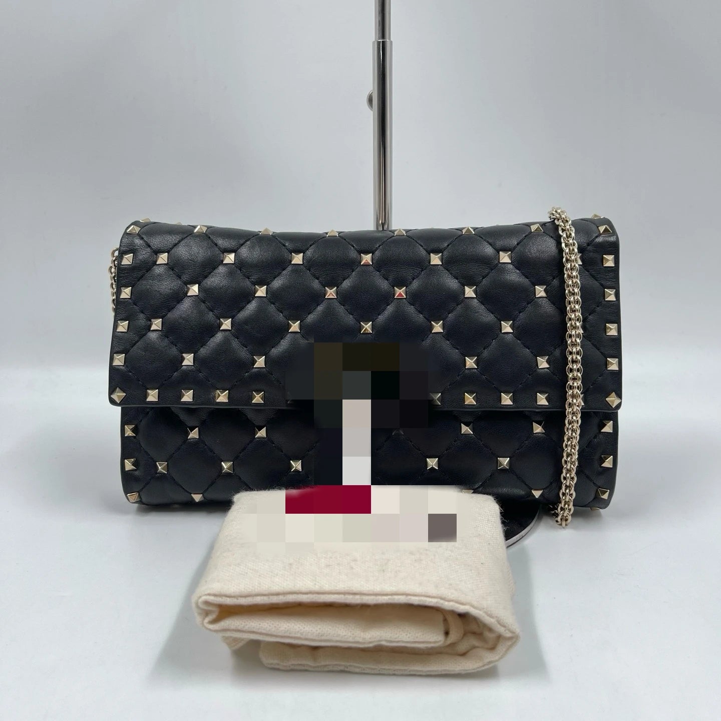 Pre-owned black quilted leather designer shoulder bag with silver rivet studs and a metal chain strap.