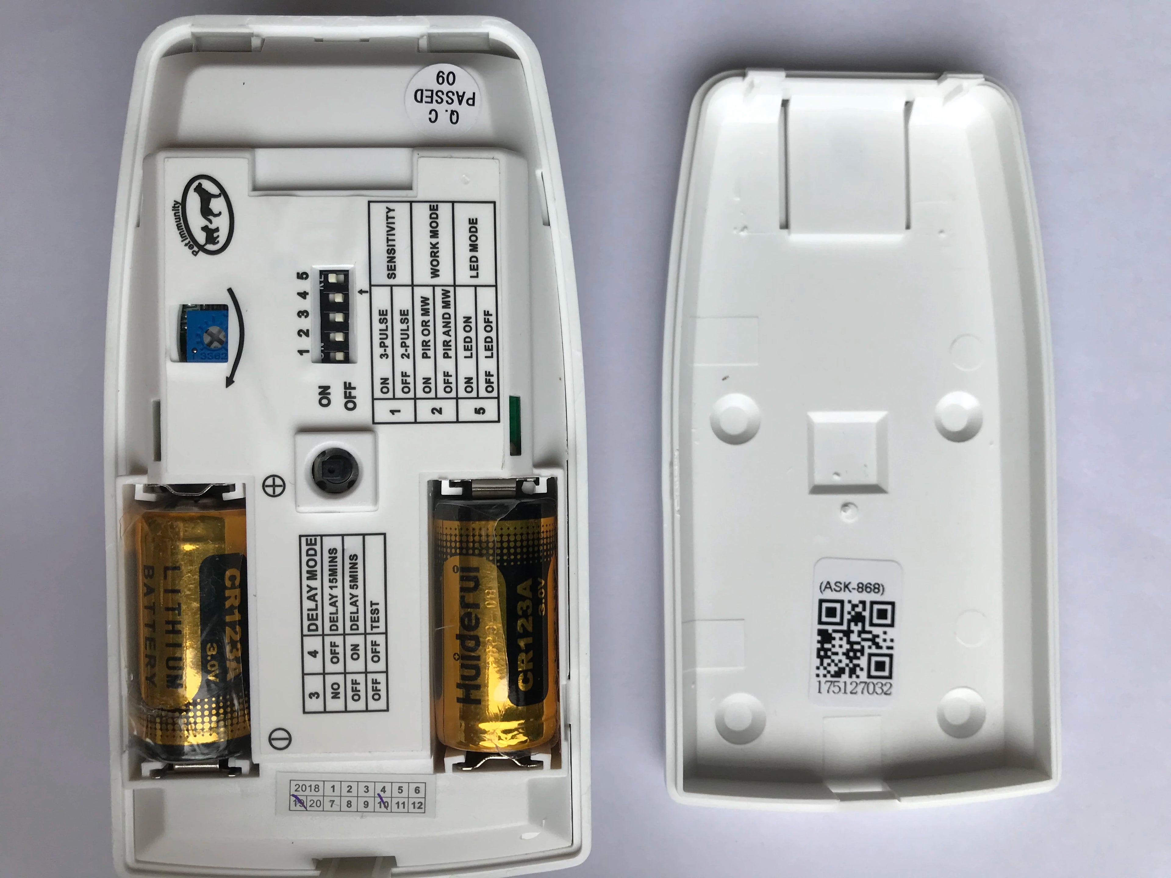 White pet-friendly dual-tech PIR motion detector with microwave sensor for secure, false-alarm-free home security.