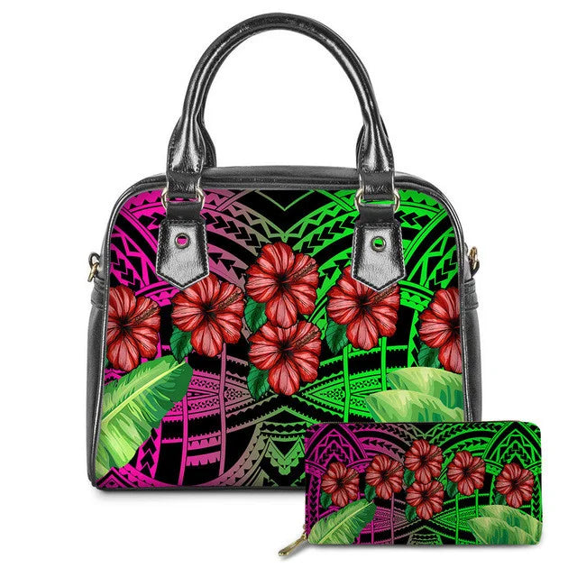 Polynesian tribal print leather handbag and wallet set with red hibiscus flowers and vibrant pink and green patterns.