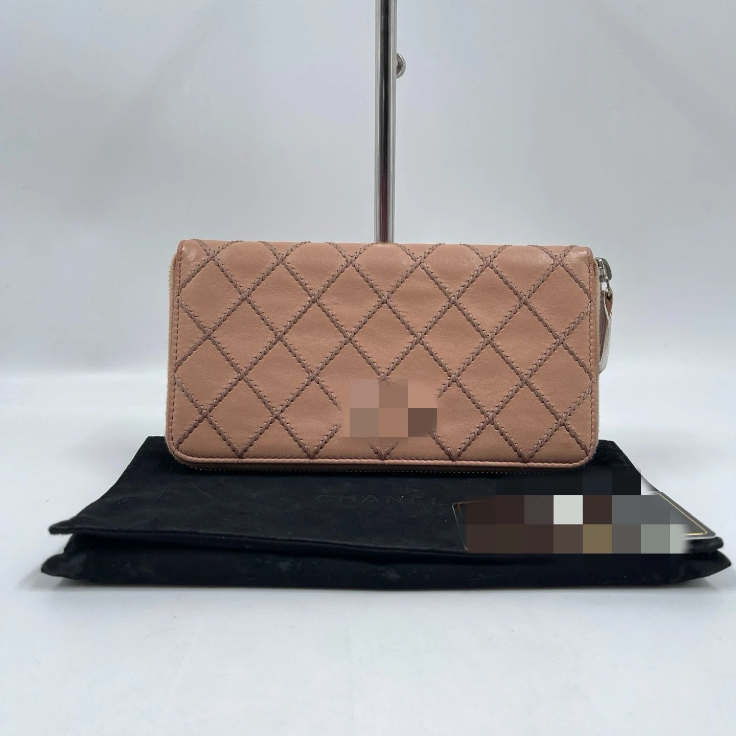Dusty pink quilted genuine leather designer wallet clutch with zip-around closure and intricate diamond stitching.
