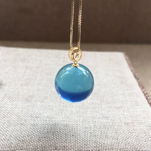 Round blue aquamarine bead pendant necklace with gold-tone chain links