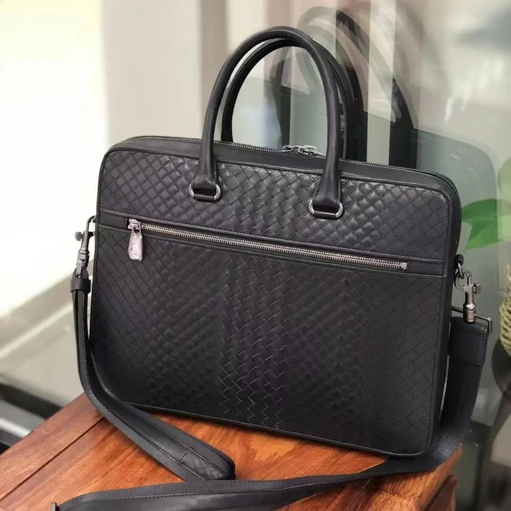 Black waxed calfskin woven leather slim 13-inch laptop briefcase for men with zip pocket and shoulder strap.