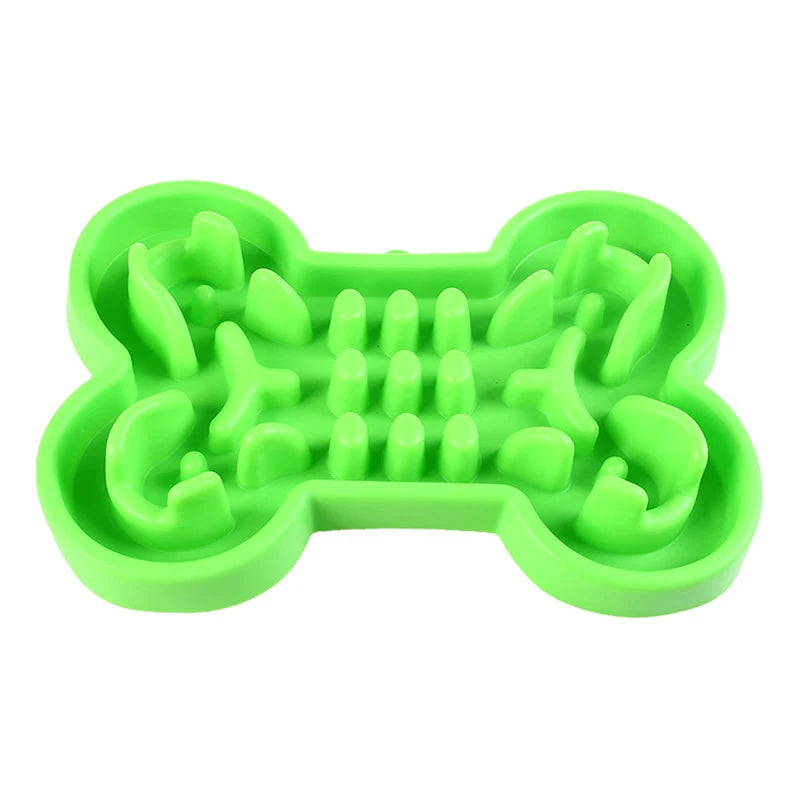 Green soft rubber bone-shaped slow feeder bowl for dogs and cats to prevent gulping and aid healthy digestion.