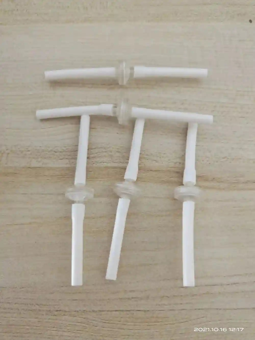 White disposable replacement connect tubes for microneedle RF machine face lifting and skin treatment accessories.