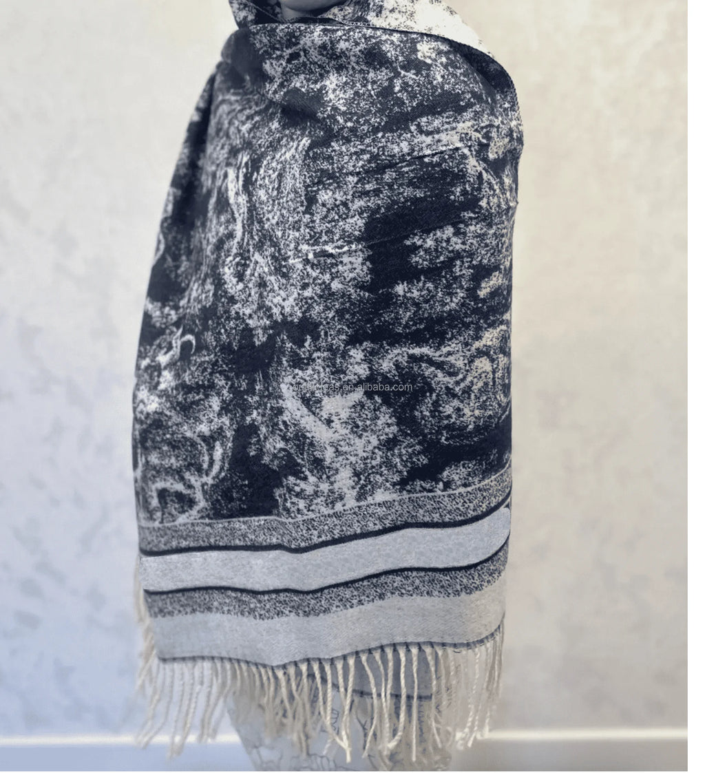 Luxury silk scarf, long rectangular shawl with black and white abstract marbled print and fringed edge detailing.