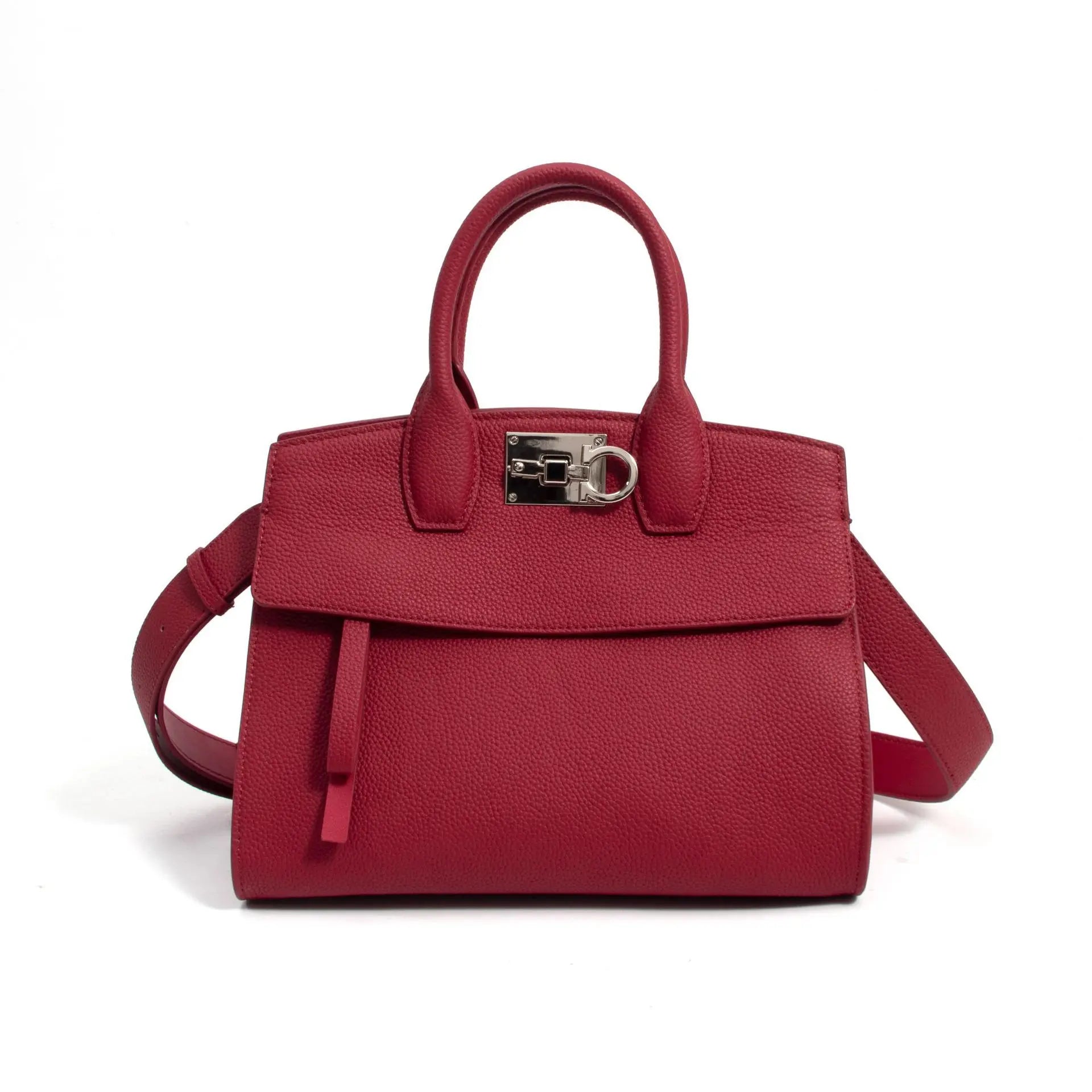 Red genuine leather designer handbag, structured tote style with silver metal clasp and shoulder strap.