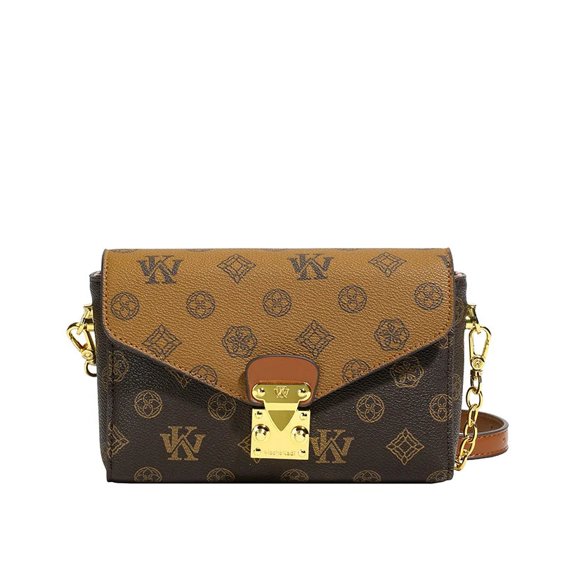 Two-tone brown leather monogram envelope crossbody bag with gold hardware and chain strap, heritage trunk style.
