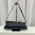 Black leather designer shoulder bag with a sleek metal frame, top clip closure, and minimalist structured silhouette.