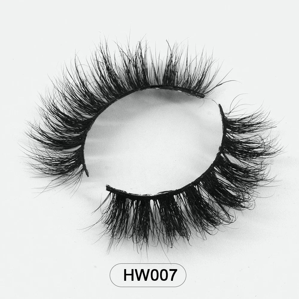 Black 3D mink false eyelashes with a thin, flexible band, shown in a curved shape on a white background.