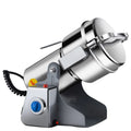 Industrial stainless steel electric grain and coffee grinder with tilt mechanism, timer dial, and silver finish.