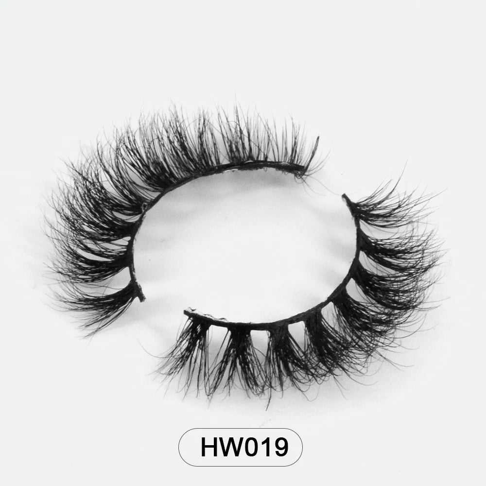 Black 3D mink false eyelashes with ultra-soft flexible band, featuring wispy, voluminous layered fibers. Model HW019.