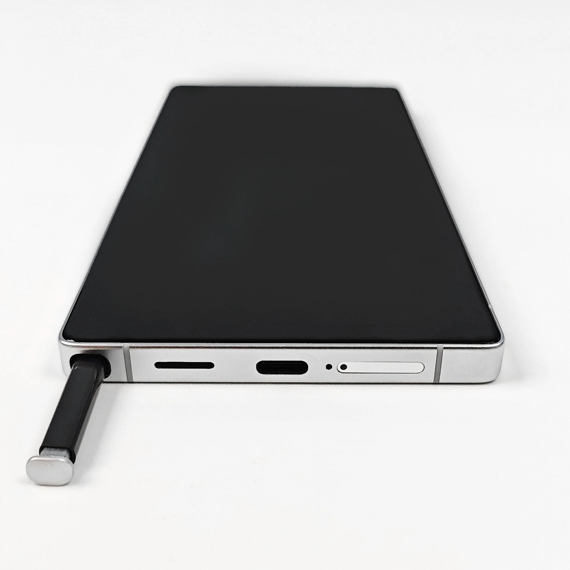 Close up of S25 Ultra smartphone showing metallic frame, side volume buttons, and USB-C port in premium finish.