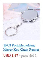 Silver portable folding pocket mirror keychain for travel, compact circular vanity mirror with keyring for easy access.