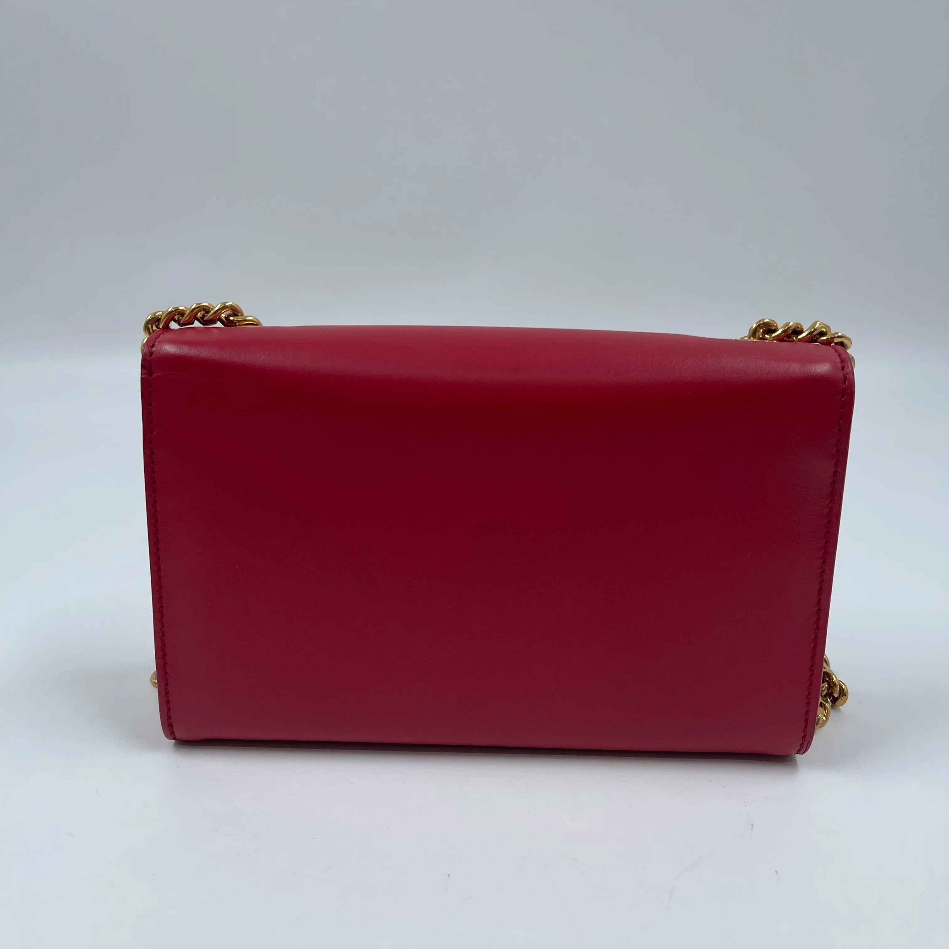 Pre-owned designer handbag in red genuine leather, square shoulder bag style with gold chain strap.