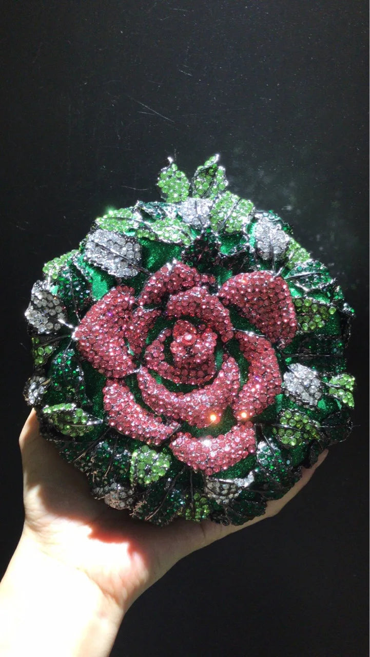 Crystal-encrusted rose clutch designer handbag, round green and pink floral evening bag for weddings and parties.