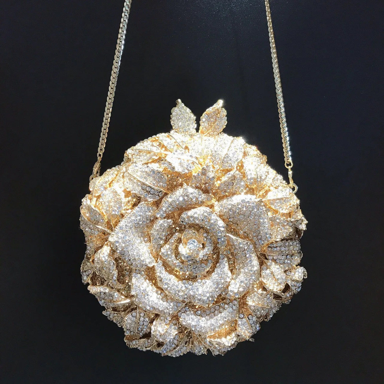 Gold crystal rose flower designer clutch bag with chain strap for wedding and evening parties.