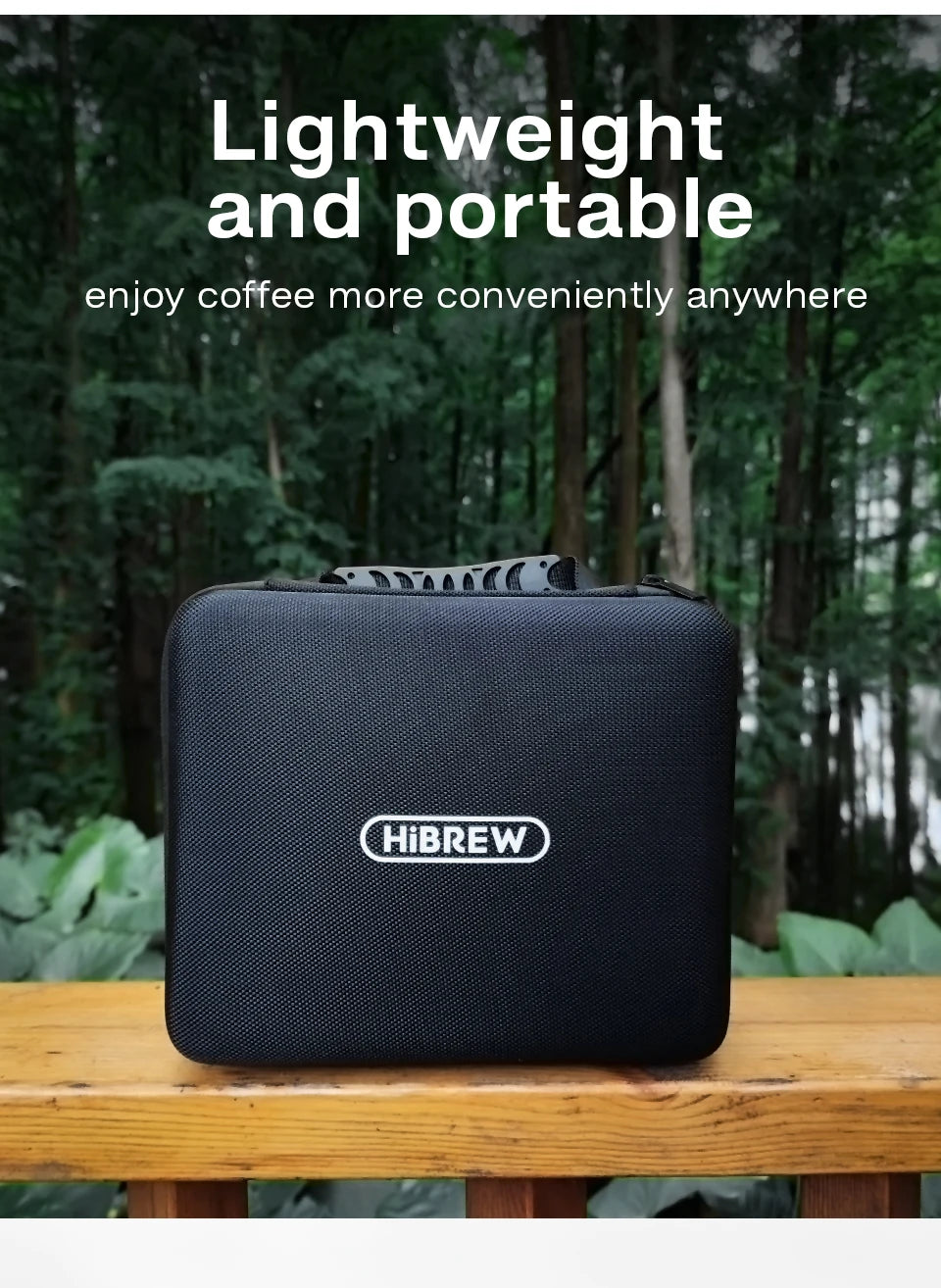 HiBREW portable black coffee maker carrying case in a forest setting, ideal for lightweight travel and camping.