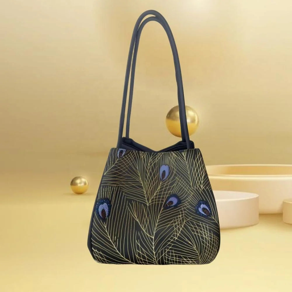Black luxury trunk handbag with gold peacock feather Su embroidery, dual long shoulder straps, and artisan finish.
