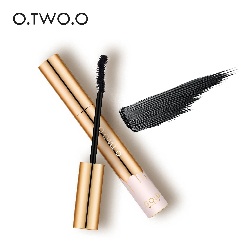 O.TWO.O gold 3D lengthening mascara tube with black brush and thick, creamy black formula swatch on white background.