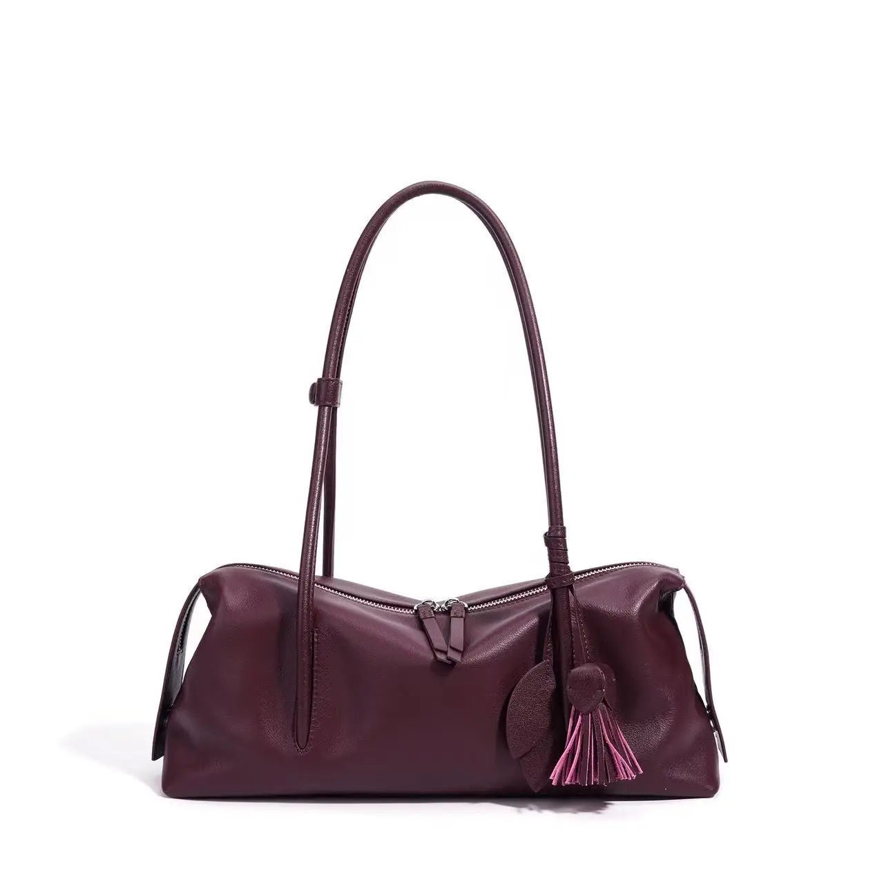 Burgundy genuine cowhide leather trunk shoulder bag with dual zipper, tassel charm, and adjustable strap.